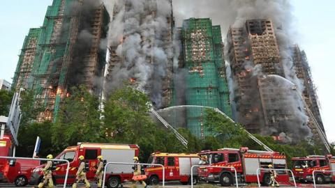 Hang in there': Agonising wait for the missing after Hong Kong blaze
