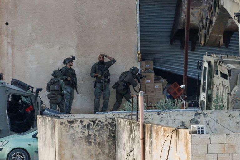 Israeli troops kill two Palestinians after they appear to surrender