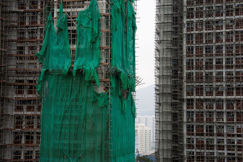 Hong Kong to vote in election as city mourns deadly fire