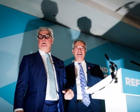 Farage dodges press as he unveils Reform’s first peer after Conservative defection